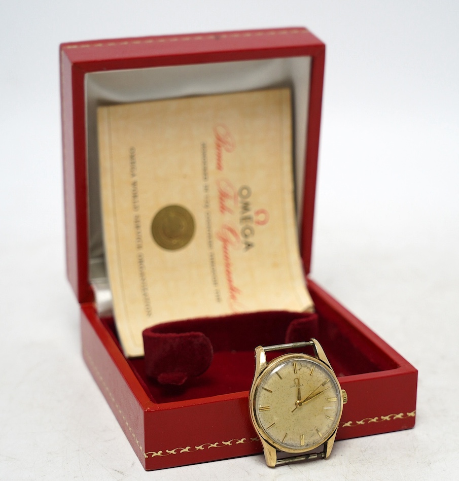 A gentleman's 9ct gold Omega manual wind wrist watch, no strap, case diameter 34mm, with Omega box. Condition - poor